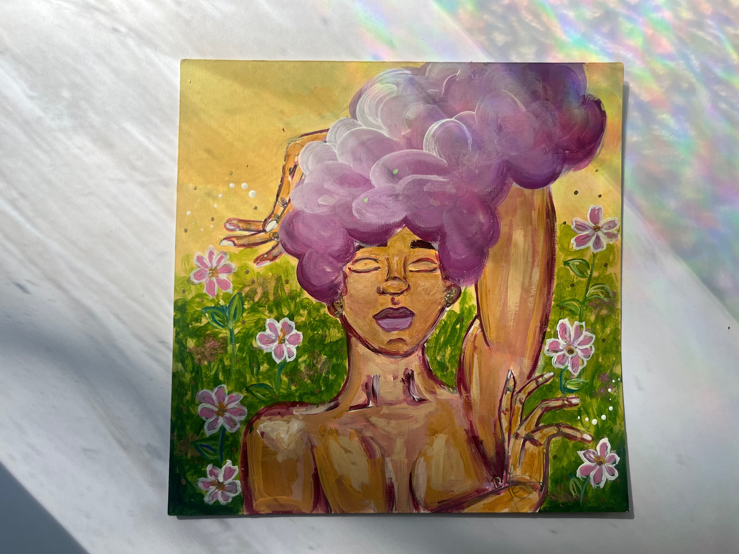 Black woman posing in painting in a field of flowers